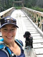 Mrs. Bonnet on bridge with her dog 